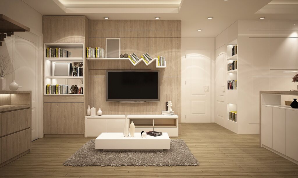 Modern living room with sleek wooden cabinetry, built-in shelves and a minimalist white coffee table.